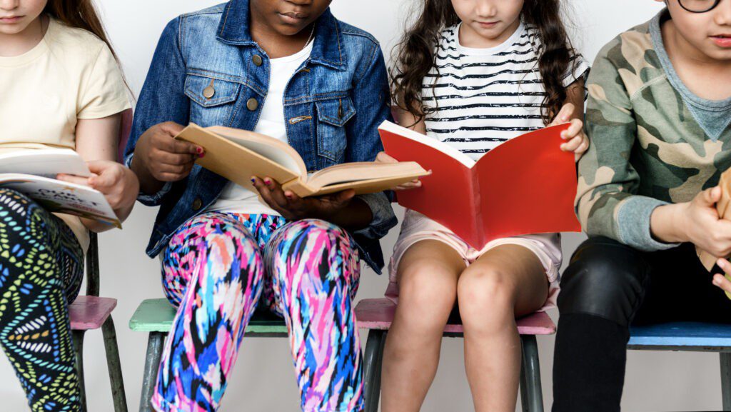 Norwell Pediatrics - Kids Reading Toddlers sitting and reading