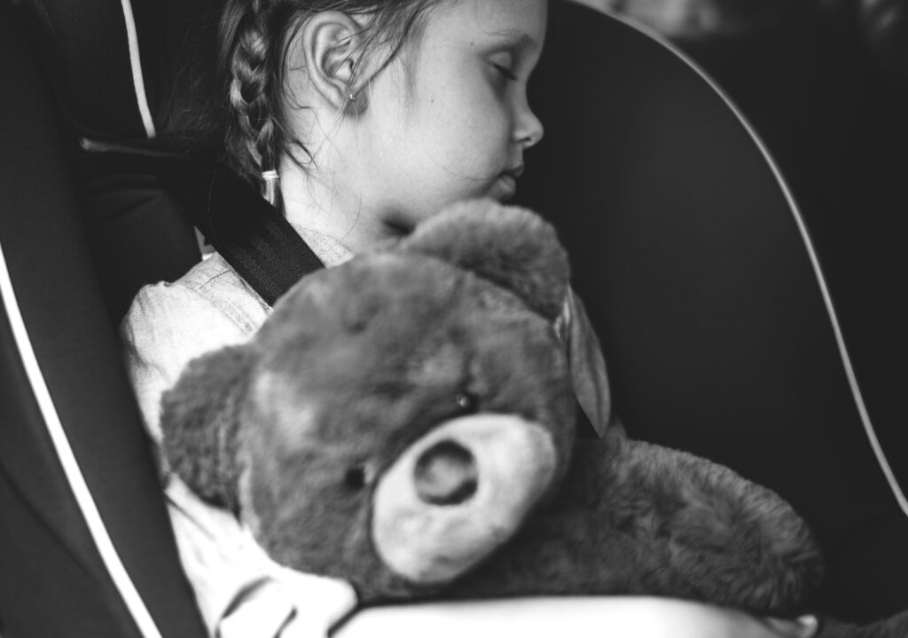 Norwell Pediatrics - Girl asleep in car seat